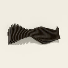 Anomaly wall sculpture, birch hand-stained black, seen from the side
