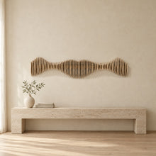 Anomaly II in natural birch above a travertine console in an ivory limewash living room