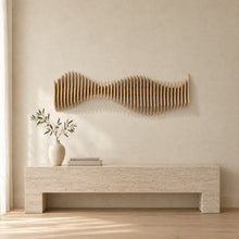 Anomaly in natural birch above a travertine console in an ivory limewash living room