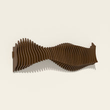 Anomaly wall sculpture, birch hand-stained in a walnut tone, seen from the side