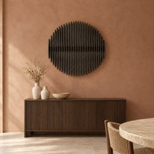 Asahi in black stain above a fluted dark-oak sideboard in a terracotta plaster dining room