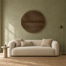 Asahi in walnut stain above a cream bouclé sofa in a sage plaster living room
