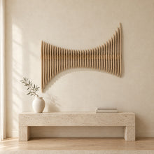 Cadence in natural birch above a travertine console in an ivory limewash living room