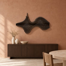 Convergence in black stain above a fluted dark-oak sideboard in a terracotta plaster dining room