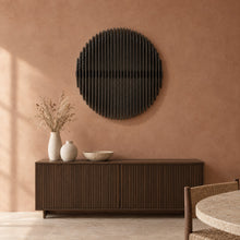 Eclipse in black stain above a fluted dark-oak sideboard in a terracotta plaster dining room