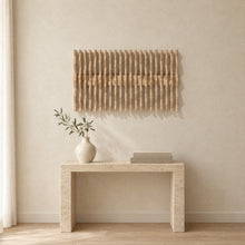 Equinox in natural birch above a travertine console in an ivory limewash living room