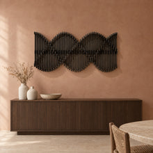 Helix in black stain above a fluted dark-oak sideboard in a terracotta plaster dining room