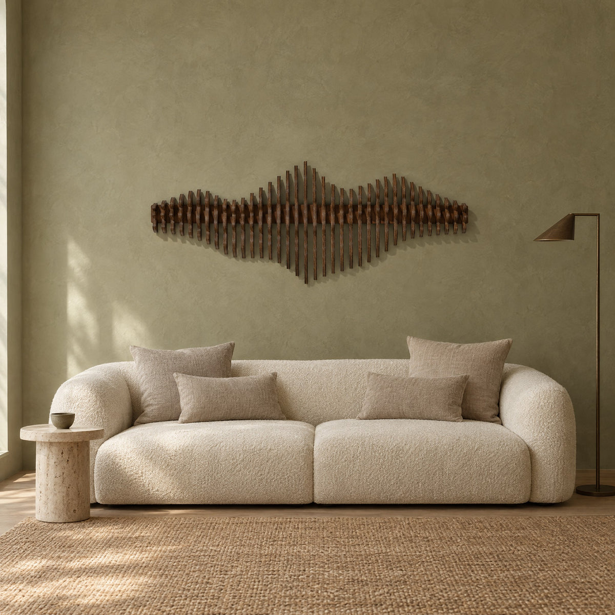 Liminal in walnut stain above a cream bouclé sofa in a sage plaster living room
