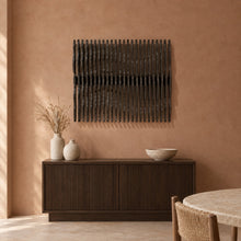 Nami in black stain above a fluted dark-oak sideboard in a terracotta plaster dining room
