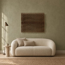Nami in walnut stain above a cream bouclé loveseat in a sage plaster living room