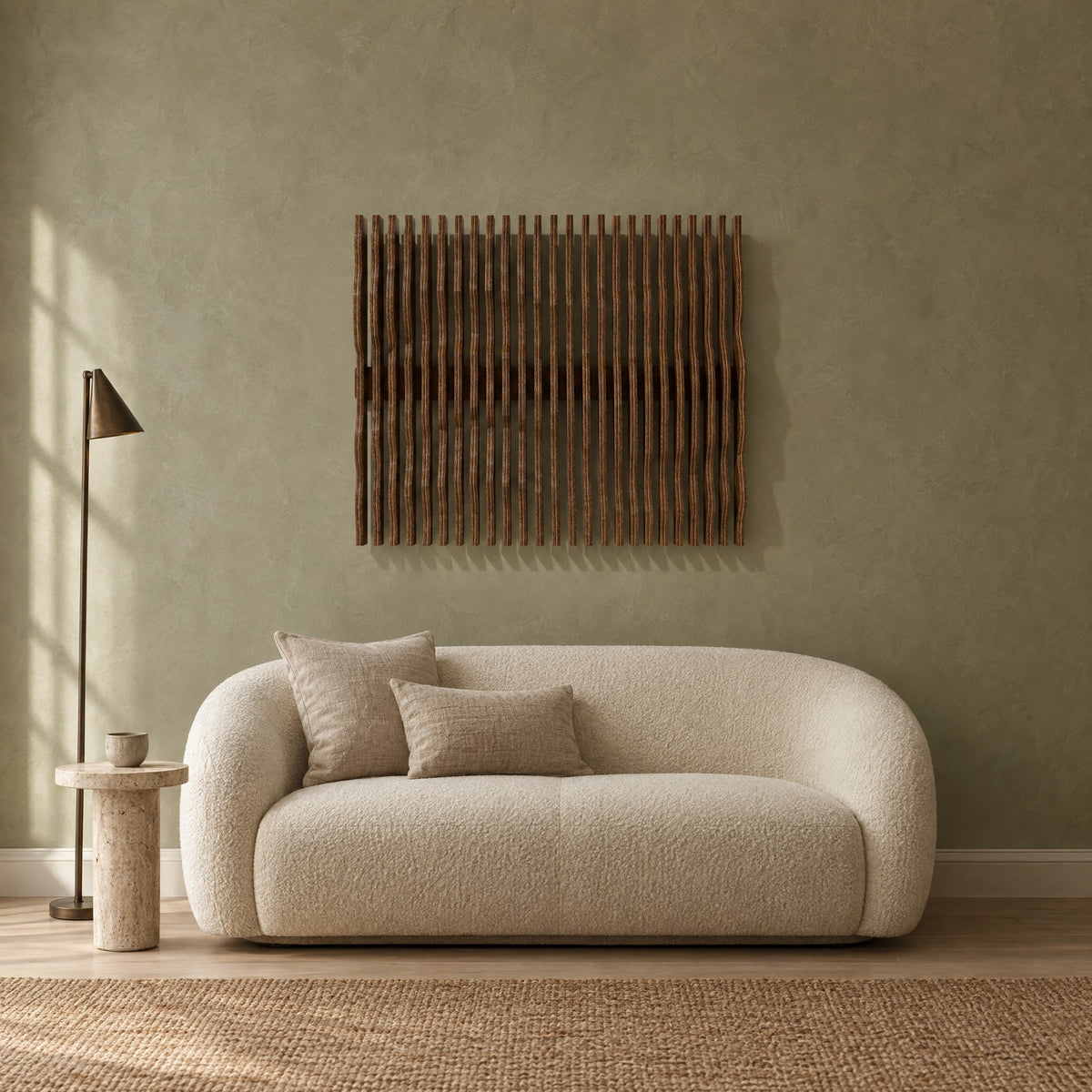 Nami in walnut stain above a cream bouclé loveseat in a sage plaster living room