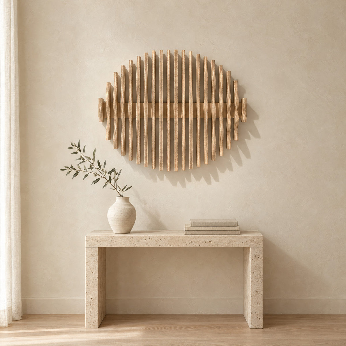 Orbit in natural birch above a travertine console in an ivory limewash living room